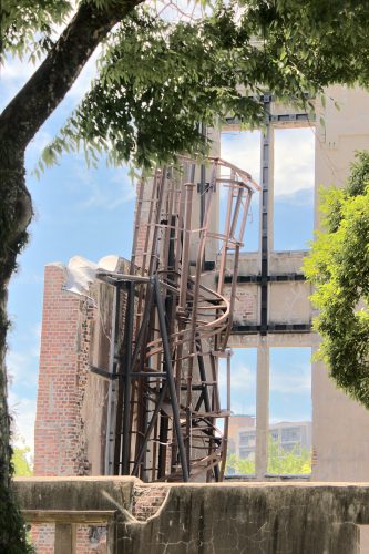 The twisted form of a metal staircase inside the ruin of the Atomic Bomb Dome