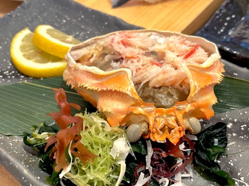 The open shell of a crab stuffed with crab meat and tomalley at Nonta Sushi in Hiroshima City