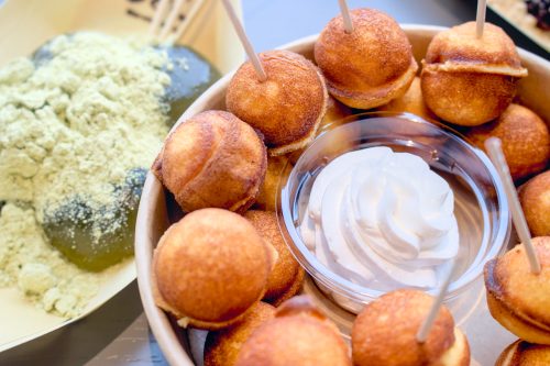 Round, baby castella cakes and a dollop of cream from Origami. On the left are matcha warabimochi from Warabimochi Motoko.