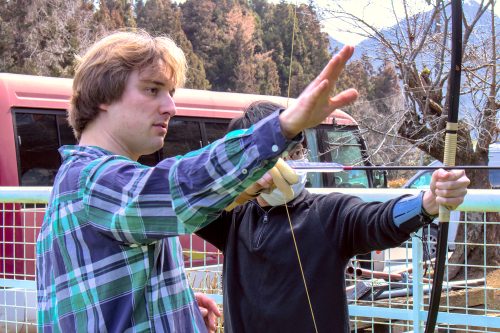 An archery instructor explaining where to shoot