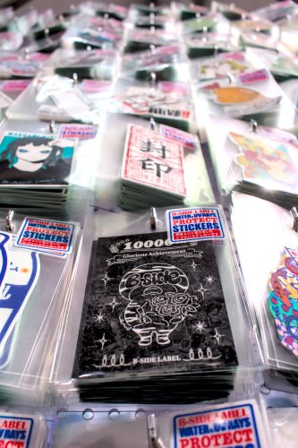 B-SIDE LABEL's celebratory 10,000th sticker on a rack amid other stickers