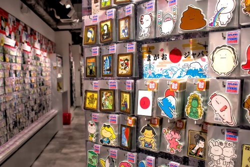 Walls covered with racks of stickers for sale