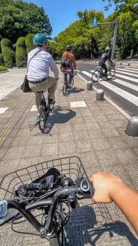A train of bikes cycles through Peace Park