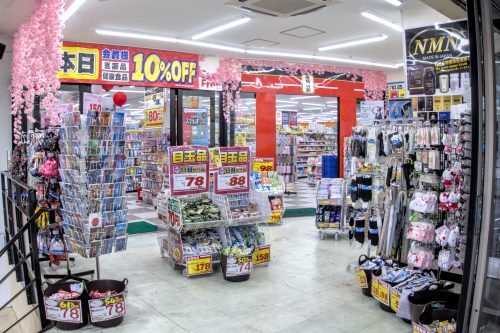 An entrance to a store crowded with items for sale