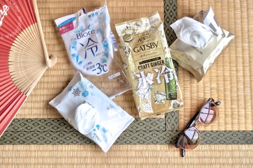 Packages and wet tissue dispensers laid on a tatami mat.