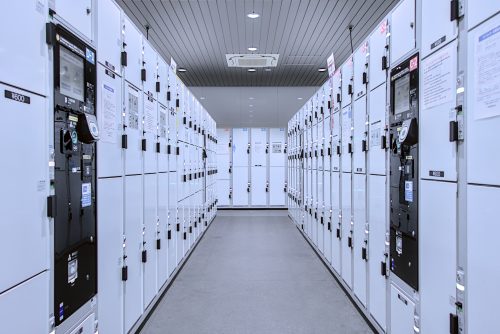 A hall lined with modern, e-pay lockers