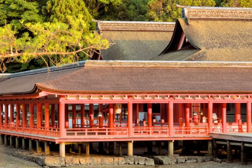 The cypress thatched roofs of ancient halls with open air hallways below rising out of seaside stone and mud.